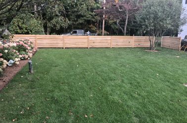 Horizontal cedar board fence
