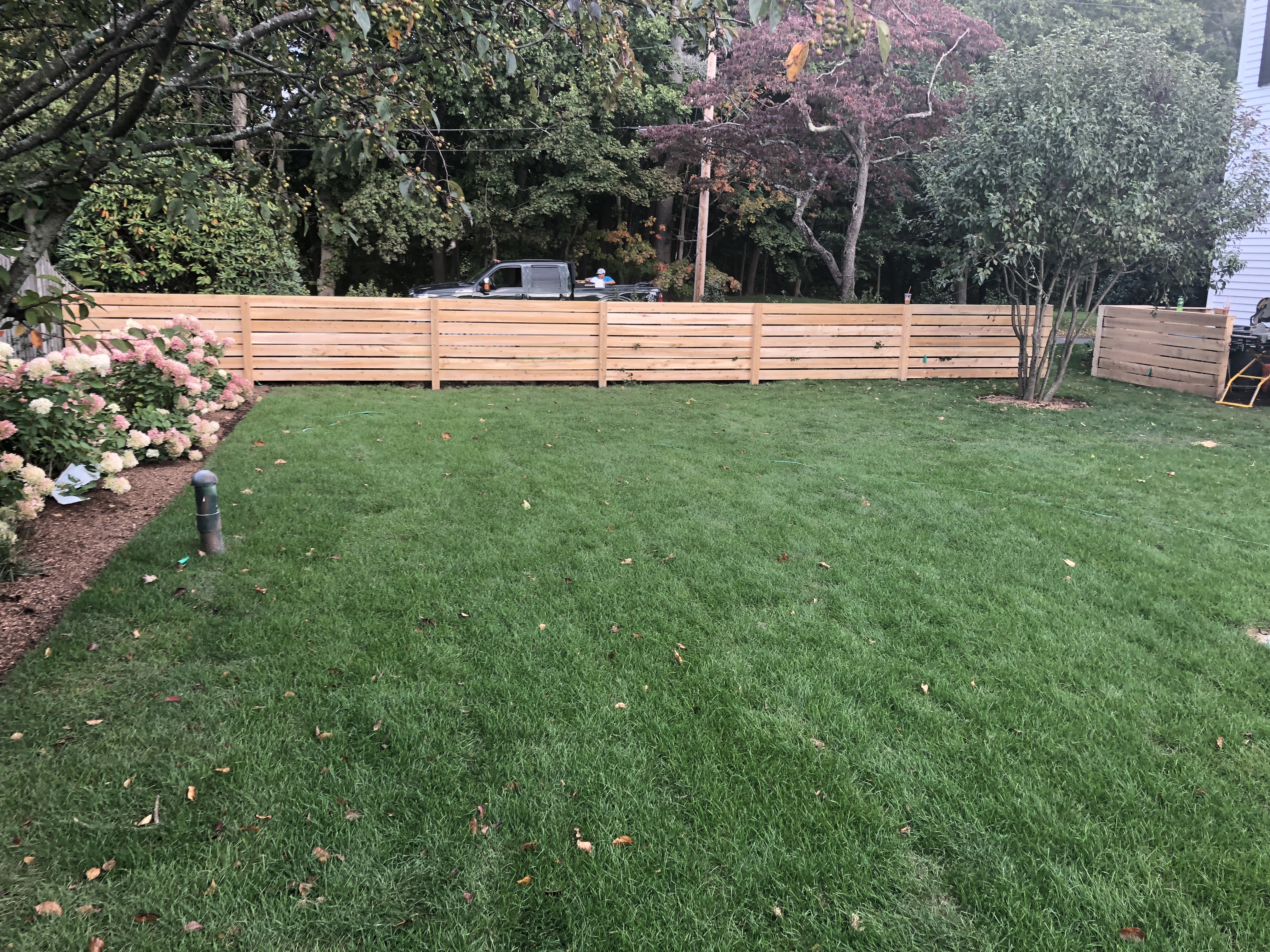 Horizontal cedar board fence