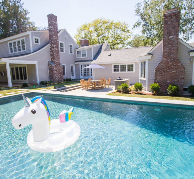 Backyard pool with unicorn floaty