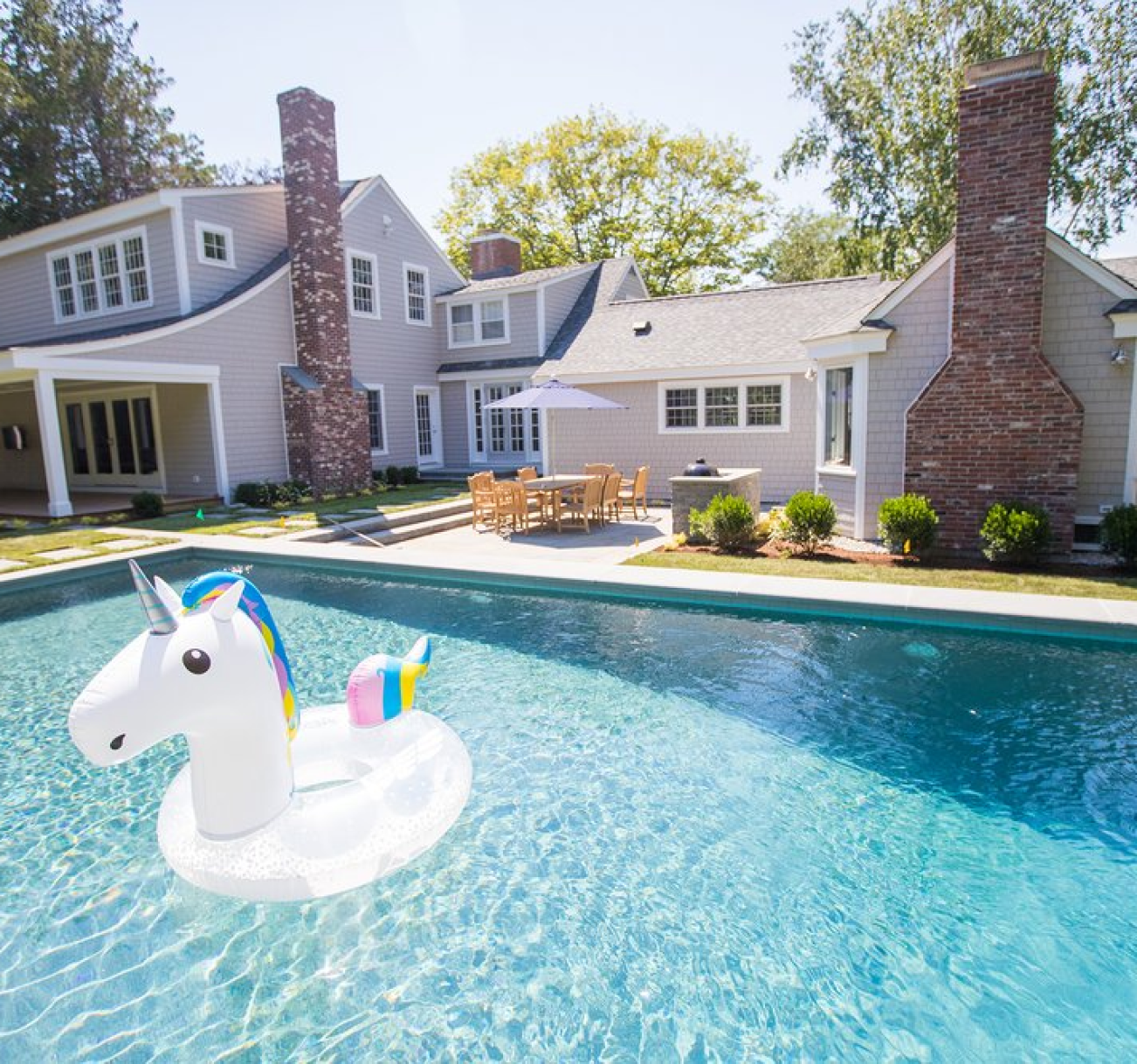 Backyard pool with unicorn floaty