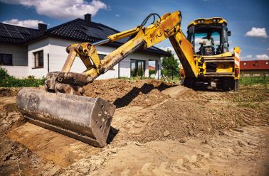 Excavator at house construction site