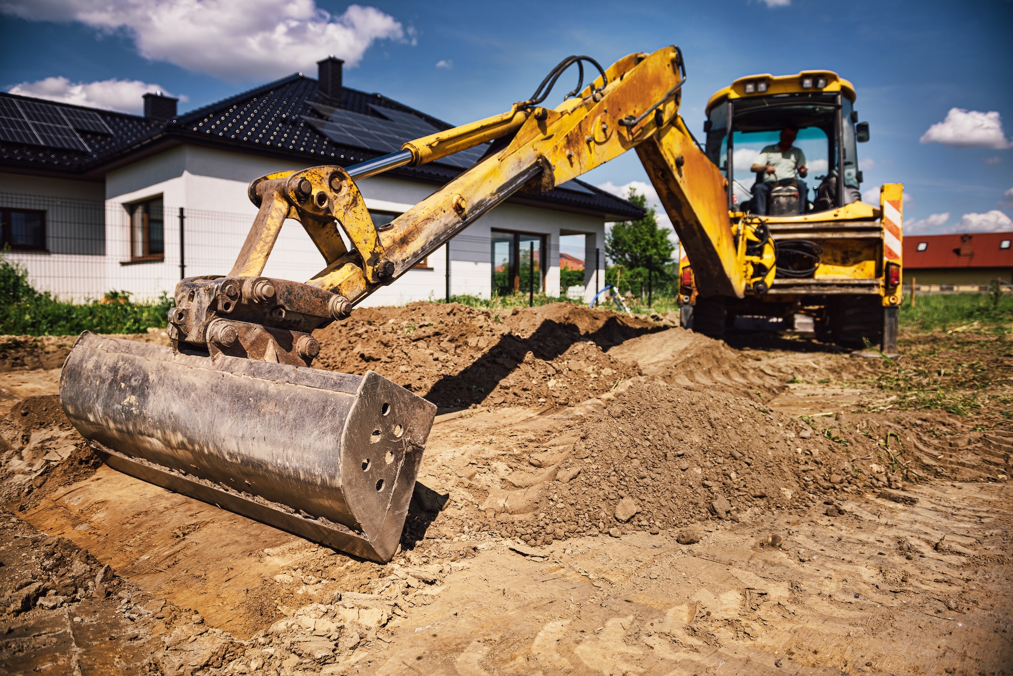 Excavator at house construction site